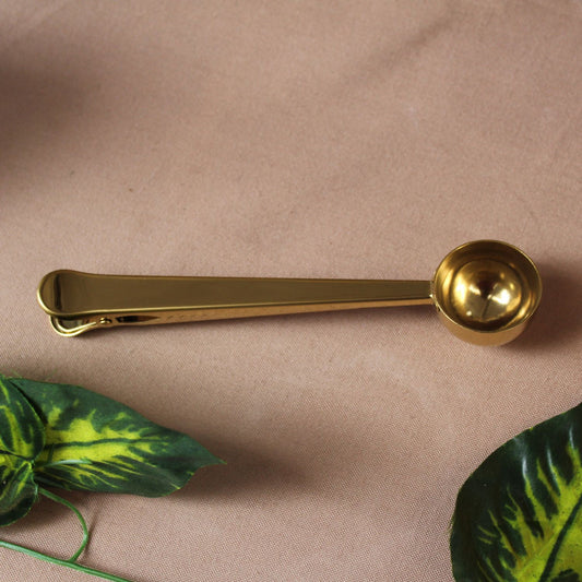 Cuchara y pinza para café
