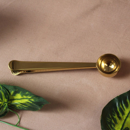 Cuchara y pinza para café
