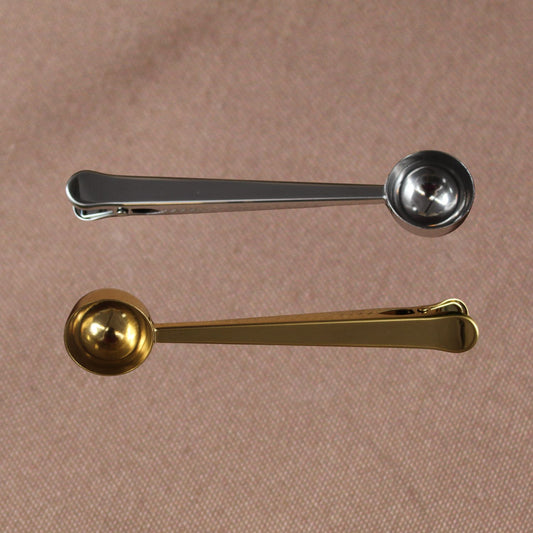 Cuchara y pinza para café